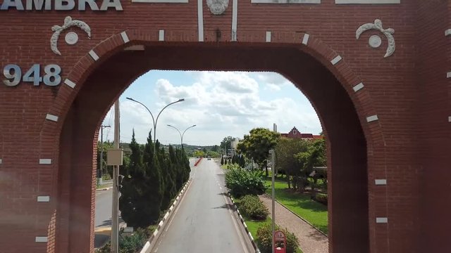 Fly through town gate in city of Holambra