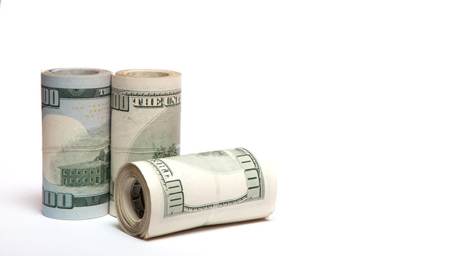 A roll of money, highlighted on a white background with copy space