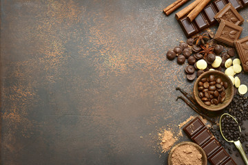Ingredients for making chocolate cake or candy : chocolate chips, bar and spices.Top view with copy...