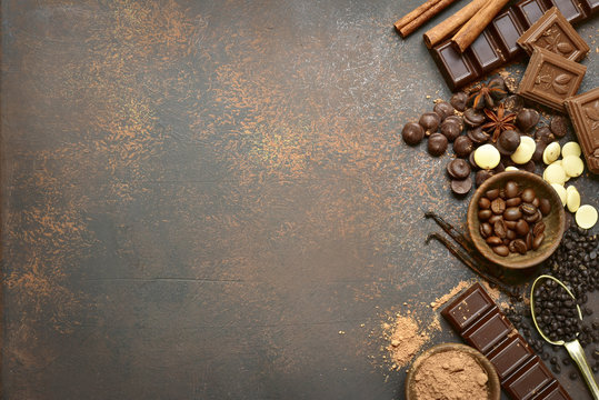 Ingredients for making chocolate cake or candy : chocolate chips, bar and spices.Top view with copy space.