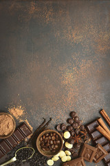 Ingredients for making chocolate cake or candy : chocolate chips, bar and spices.Top view with copy space.
