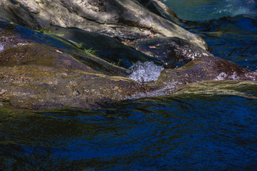 Fototapeta na wymiar Valley, water and stones scenery 