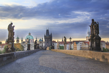 Beautiful view of Old Town Tower of Charles Bridge at dawn in Prague, Czech Republic