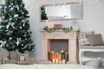 Stylish living room interior with decorated Christmas tree