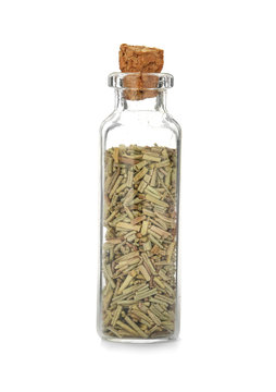 Glass bottle with spice on white background