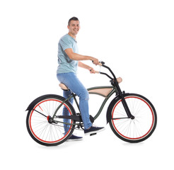 Fototapeta na wymiar Portrait of handsome man with bicycle on white background