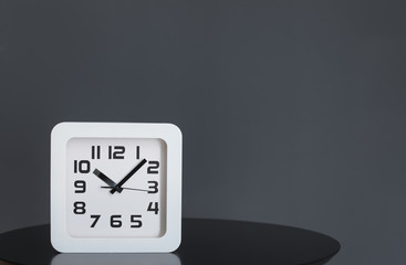 Modern clock on table. Time of day