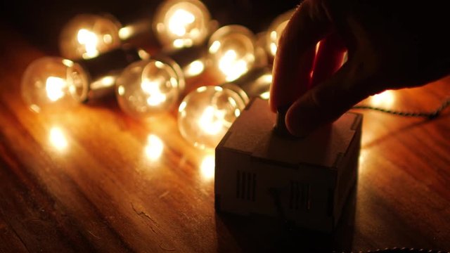 man's hand dimmable incandescent lamps darker