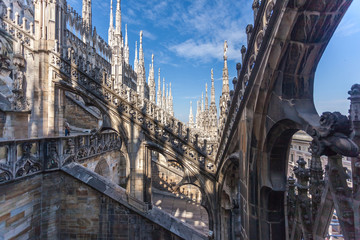 Naklejka premium view of Gothic architecture and art on the roof of Milan Cathedral (Duomo di Milano), Italy