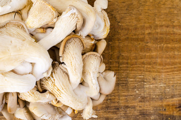 Oyster mushrooms on wooden table