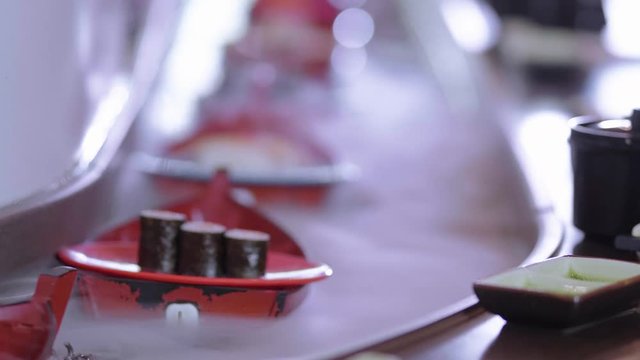 Running Sushi Buffet - Suhi rolls on boats