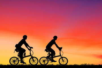 silhouette Sport man whit bike on sunrise