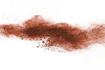 Naklejka na ściany i meble Brown powder explosion isolated on white background.