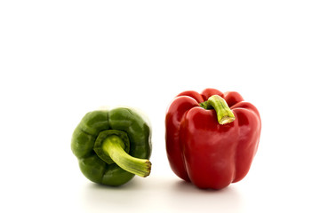 Red Sweet bell pepper and Green Sweet bell pepper isolated on Blue background.