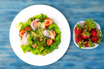 Vegetable salad with ham, strawberries, chia seeds