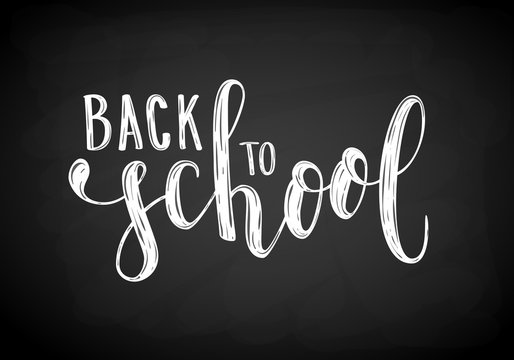 Back to school. Hand drawn brush pen lettering on black chalkboard. design for holiday greeting card and invitation, flyers, posters, banner.