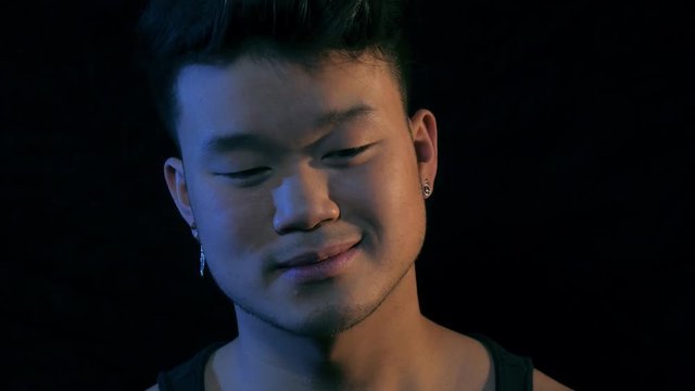 Head shot portrait of a young Asian man. Close up.