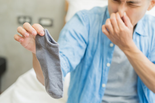 man with smelly socks
