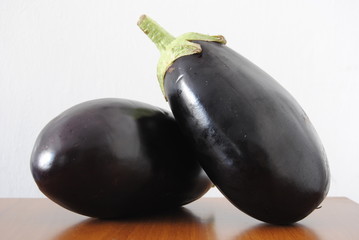 Two oval ripe aubergines