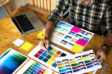 Graphic designers choose colors from the color bands samples for design .Designer graphic creativity work concept .