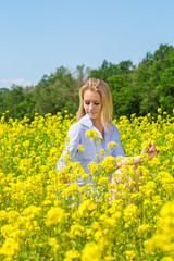 Fototapeta premium Woman in yellow flowers