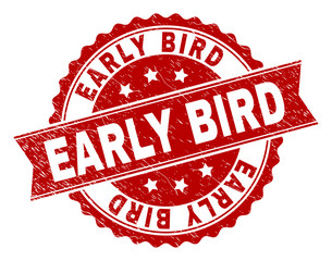 EARLY BIRD seal print with distress texture. Rubber seal imitation has round medal form and contains ribbon. Red vector rubber print of EARLY BIRD label with unclean texture.