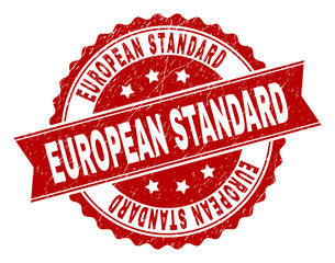 EUROPEAN STANDARD seal print with distress texture. Rubber seal imitation has circle medallion shape and contains ribbon. Red vector rubber print of EUROPEAN STANDARD label with grunge texture.