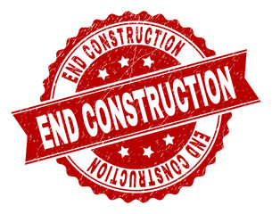 END CONSTRUCTION seal imprint with corroded style. Rubber seal imitation has circle medal form and contains ribbon. Red vector rubber print of END CONSTRUCTION tag with corroded texture.
