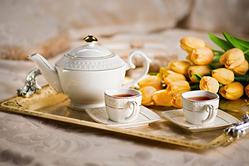 Romantic tea set with flowers. Nice good morning. Breakfast in bed. 