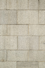 New stone wall of large granite blocks
