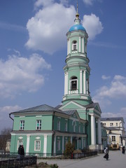 round bell tower of gentle green color against the blue sky