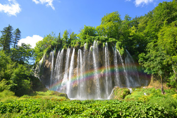 Fototapeta premium Beautiful waterfalls with rainbow in Plitvice Lakes National Park, Croatia, Europe. 
