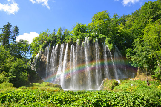 Fototapeta Beautiful waterfalls with rainbow in Plitvice Lakes National Park, Croatia, Europe. 
