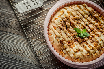 peach pie on an old wooden table