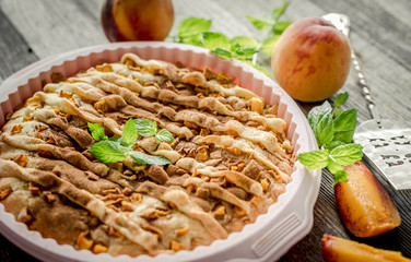 peach pie on an old wooden table