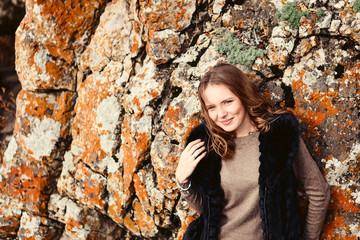 Portrait of a beautiful girl near mountains