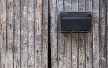 Iron Mailbox on Wooden Door