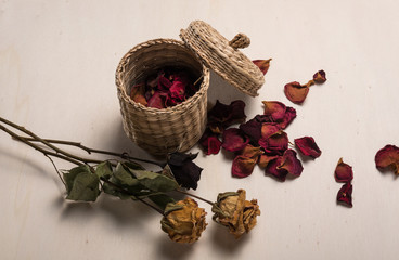 floral arrangement with dried flowers and straw basket