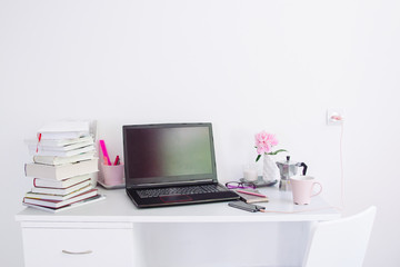 Dorm room, table with stationery and laptop. back to school, ready for studying.