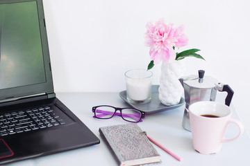 business woman back to work. coffee, laptop, phone.