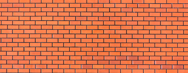 Wall from a red brick as an abstract background