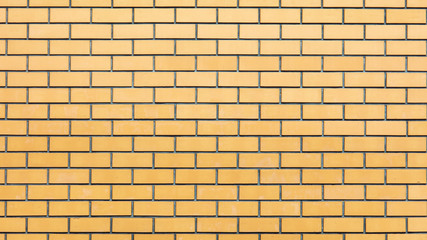 Fototapeta premium Yellow bricks in the wall as an abstract background