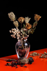 floral arrangement with dried flowers in glass jar