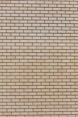 Yellow bricks in the wall as an abstract background