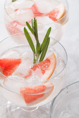 Citrus lemonade water with grapefruit sliced , healthy and detox water drink in summer on concrete table.