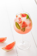 Citrus lemonade water with grapefruit sliced , healthy and detox water drink in summer on concrete table.