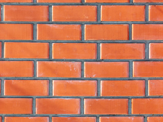 Wall from a red brick as an abstract background