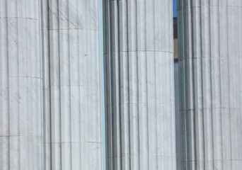 White architectural pillars on the building as a background