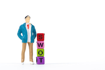 Businessman or manager with SWOT text made from colorful beads or letter bead on white background, finance and business concept.