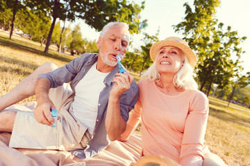 Back to childhood. Low angle shot of a positive minded husband and wife recalling their memories...